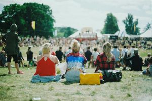 Group of people on a grassy field on a sunny day