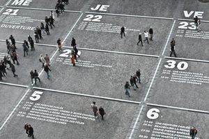 Aerial photo of people crossing a road intersection